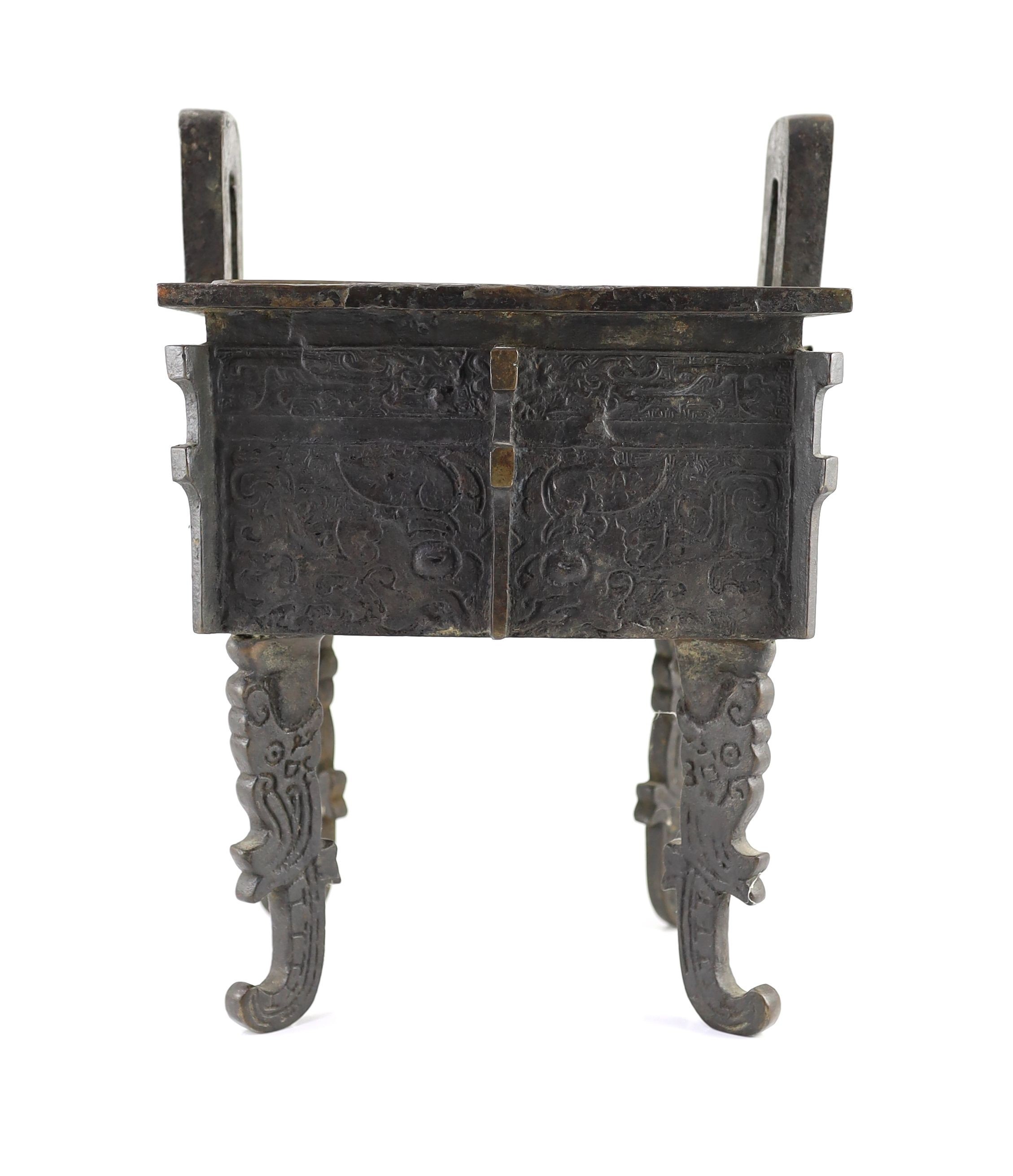 A Chinese archaistic bronze rectangular censer, fangding, 17th/18th century 34cm high, 24cm wide, 20cm depth later liner and repairs to legs